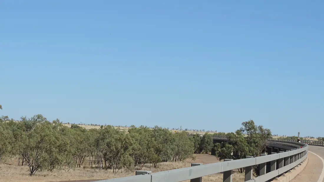 Driving across the Georgina River Bridge from Camooweal looking south at the dry river bed, 2019 03