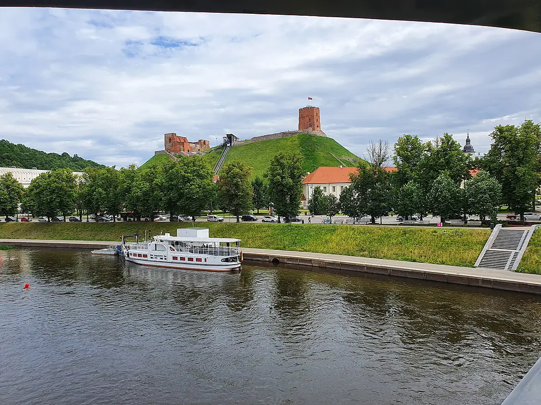 Gediminas Tower and ship in Neris River in Vilnius, Lithuania