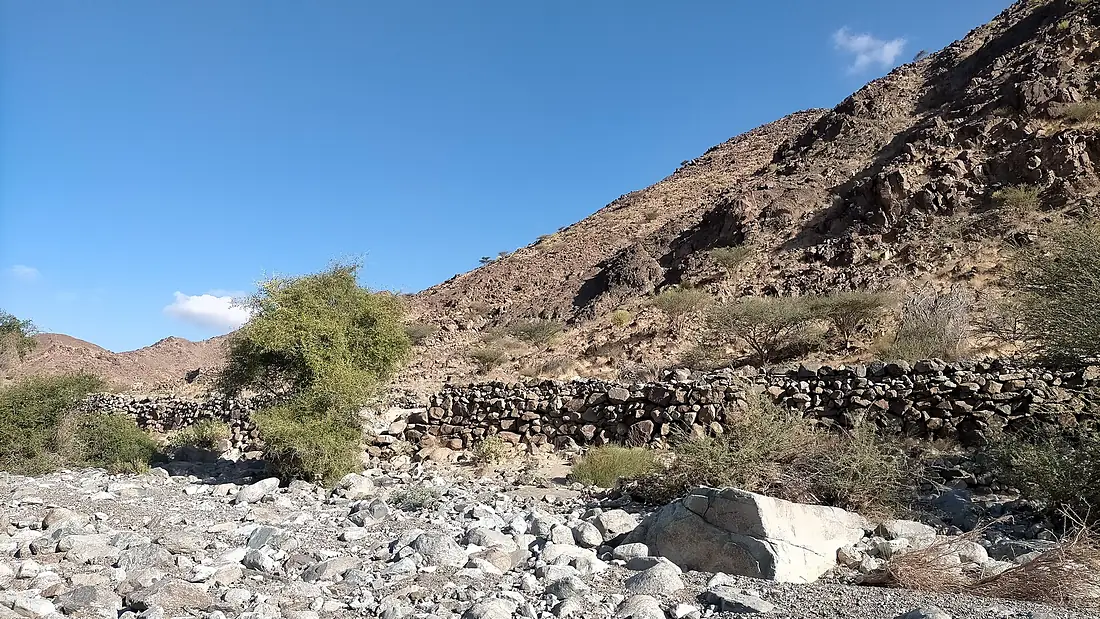 Ruins of the old village of Mazdiya - Ancient dry-stone buildings on the banks of the Wadi Al Helo
