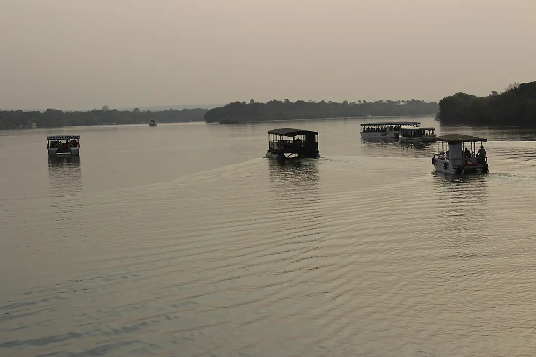 Boats in Zambezi river at Sunset